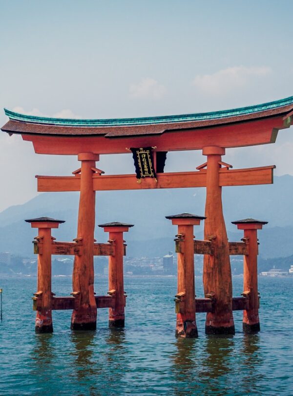 red shrine in body of water