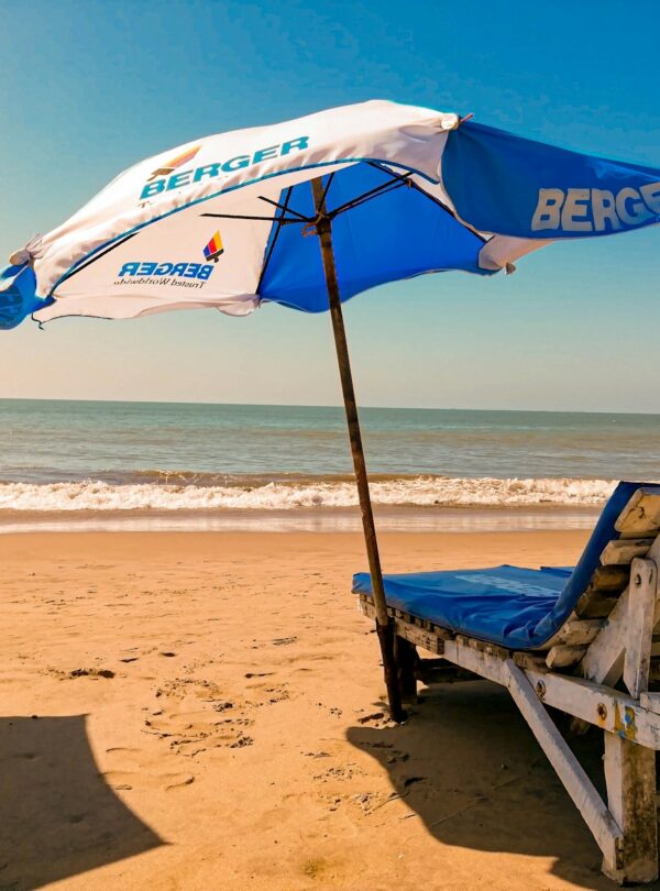 brown wooden chair on beach during daytime