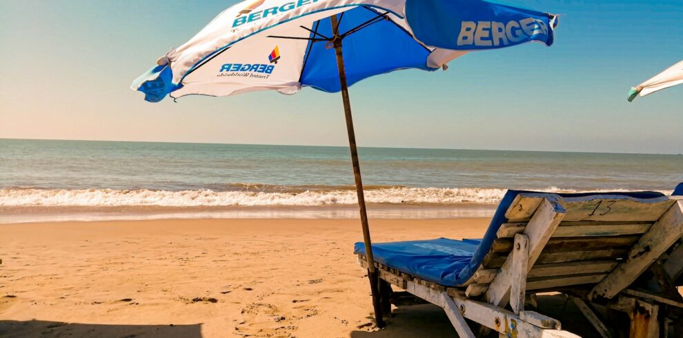 brown wooden chair on beach during daytime