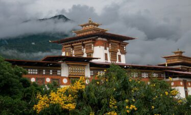 A building with a mountain in the background
