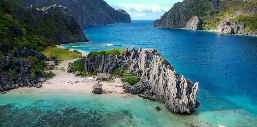 aerial photo of body of water between mountains