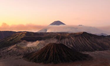 silhouette photo volcanoes during golden hour