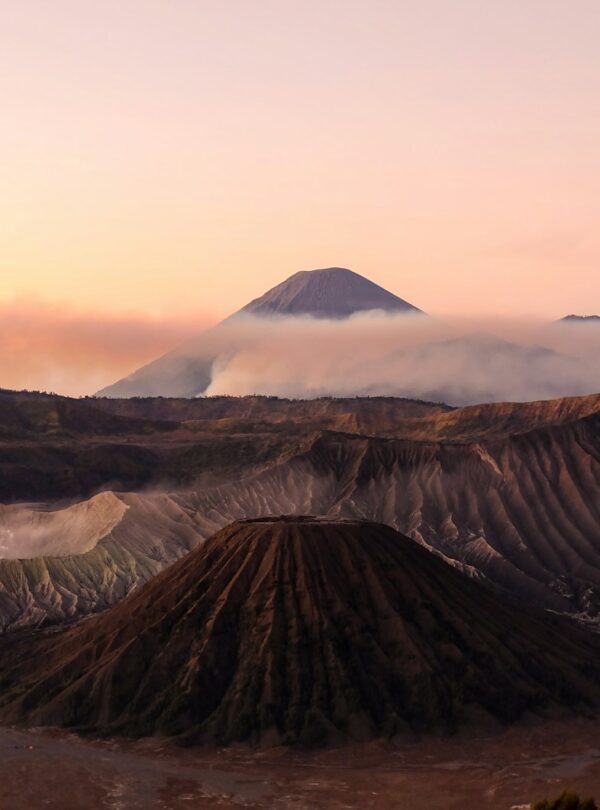 silhouette photo volcanoes during golden hour