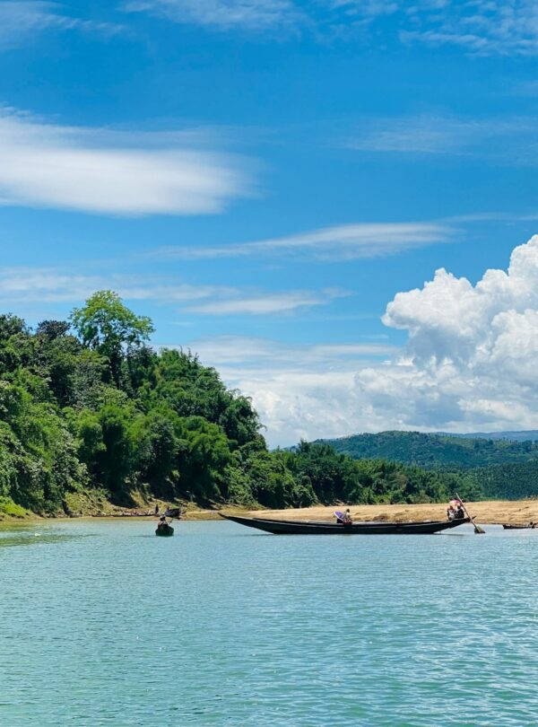 people riding on boat on river during daytime