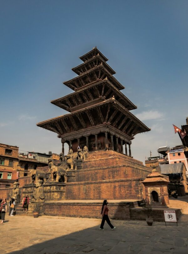 a very tall building sitting in the middle of a town
