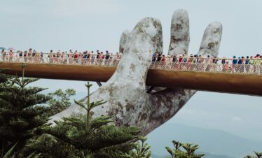 people walking on bridge during daytime