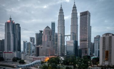 city buildings under white cloudy sky during daytime