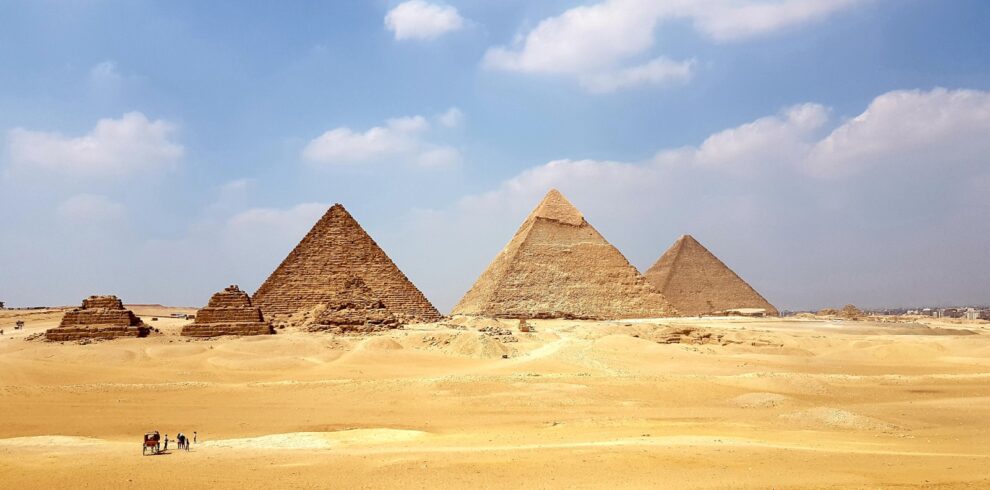 brown pyramid under blue sky during daytime