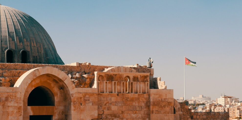 an old building with a flag on top of it