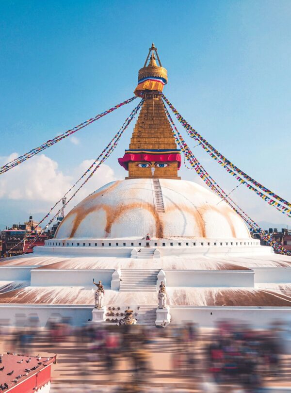 white and gold concrete building under blue sky during daytime