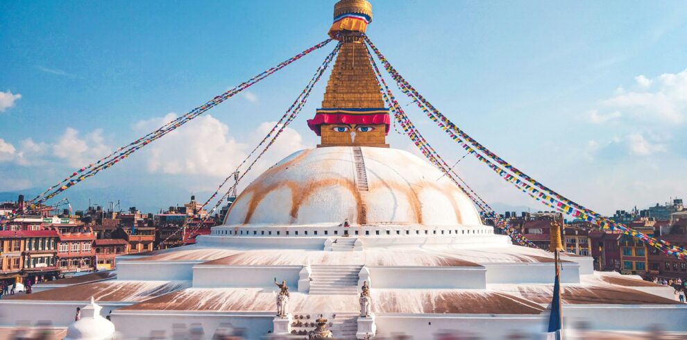 white and gold concrete building under blue sky during daytime