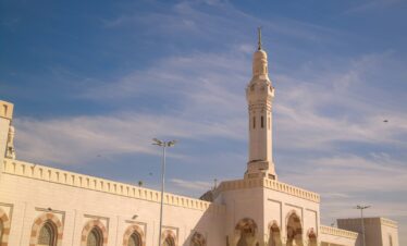 A large white building with a clock tower